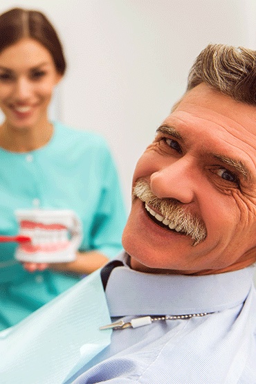 man smiling with dentures